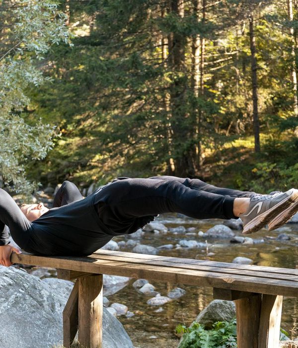 Focused man doing a bodyweight exercise with concentration and proper form.